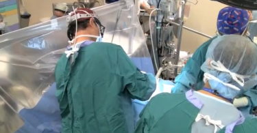 Surgeons performing heart surgery