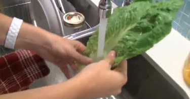 Washing veggies under tap