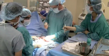 Surgeons performing hernia surgery