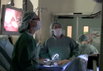 Doctors performing minimally invasive surgery