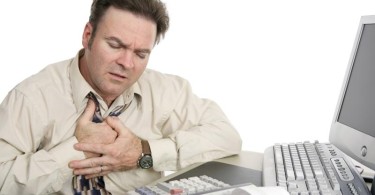Man grasping chest