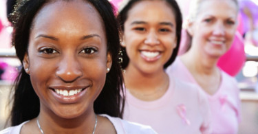 Women in pink smiling