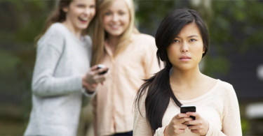 Woman being bullied by two others