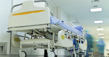 Hospital bed in hospital hallway