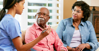 Doctor speaking with patients