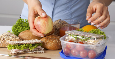 Woman packing a healthy lunch