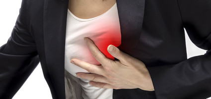 woman having heart attack holding chest