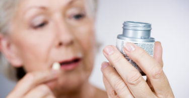 Woman taking medication