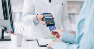 Woman purchasing medication