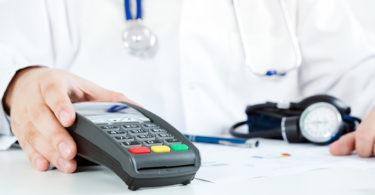 Doctor accepting payment