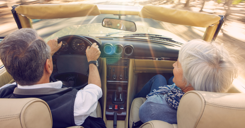 Two elderly people in a car