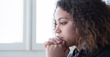 young woman alone at home