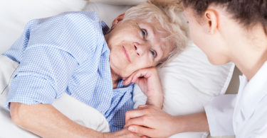 Elderly woman in bed