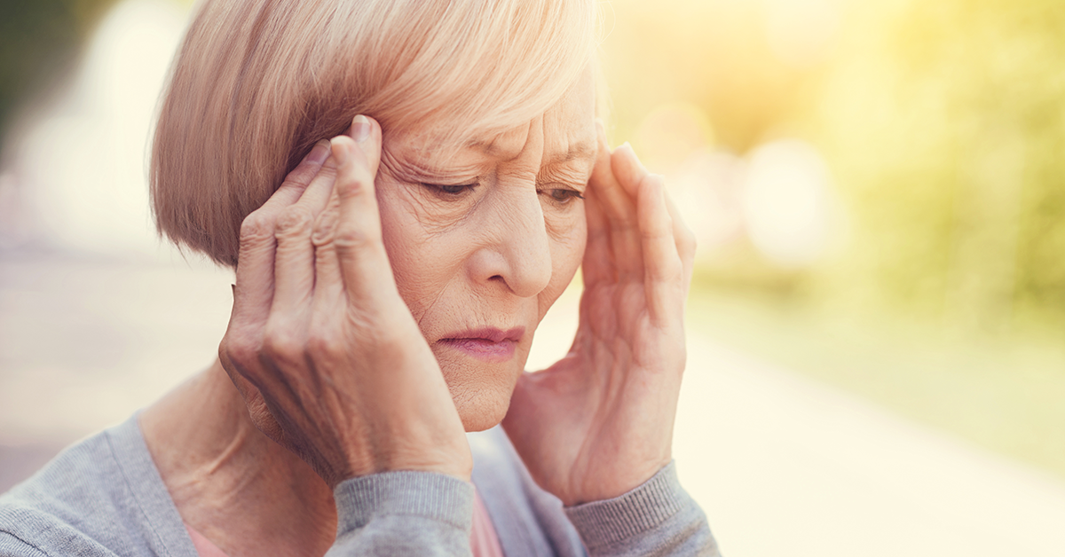 elderly woman with headache