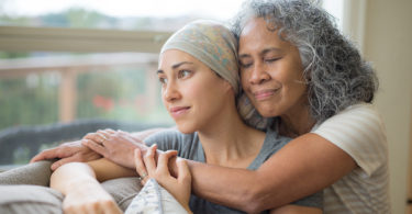 20-year-old woman with cancer and her Mom.