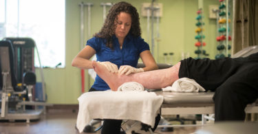 Physiotherapist Lisa Giardino treats a burn patient in outpatient services at Sunnybrook's St. John’s Rehab.