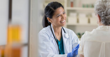 Pharmacist administering flu shot