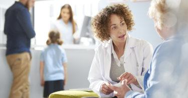 pharmacist talking to woman