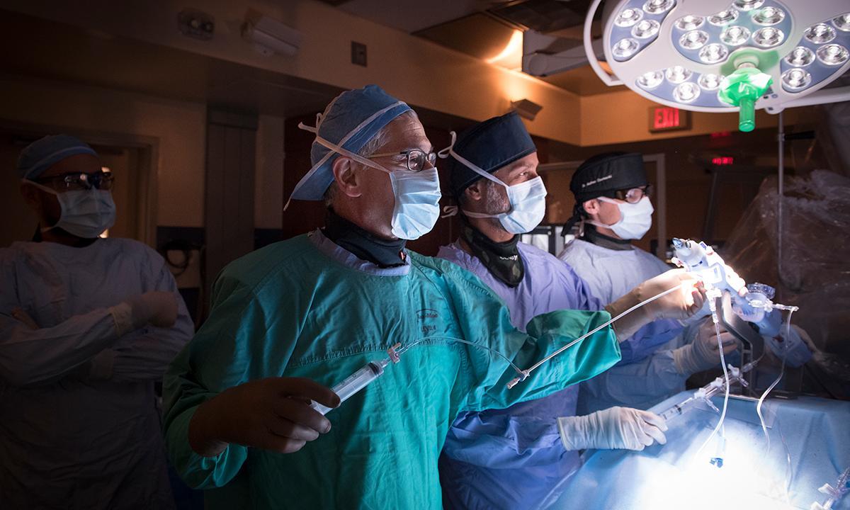 Dr. Eric Cohen (left), Dr. Gideon Cohen and Dr. Andrew Czarnecki perform a mitral valve replacement