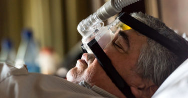 man with sleep apnea machine