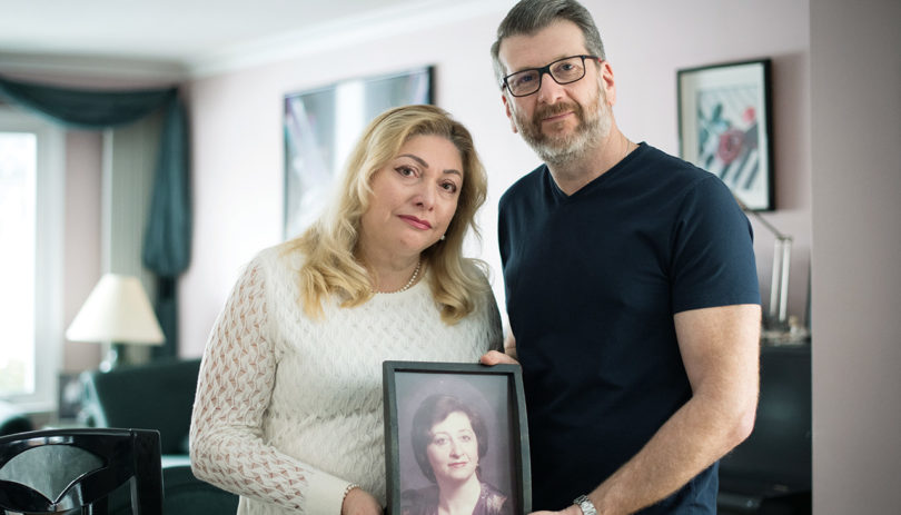 Lana Lewis and Russell Korus hold a photo of their late mother Annie Korus.