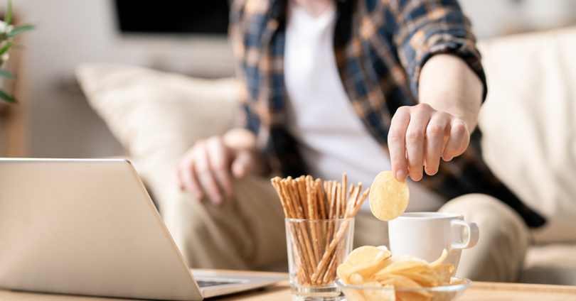 man eating while working