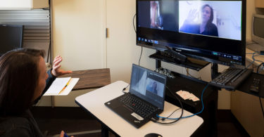 Physiotherapist Jean Yee at St. John's Rehab during a virtual care appointment