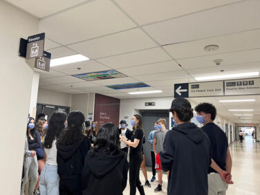 Students stand in a hallway at Sunnybrook hospital